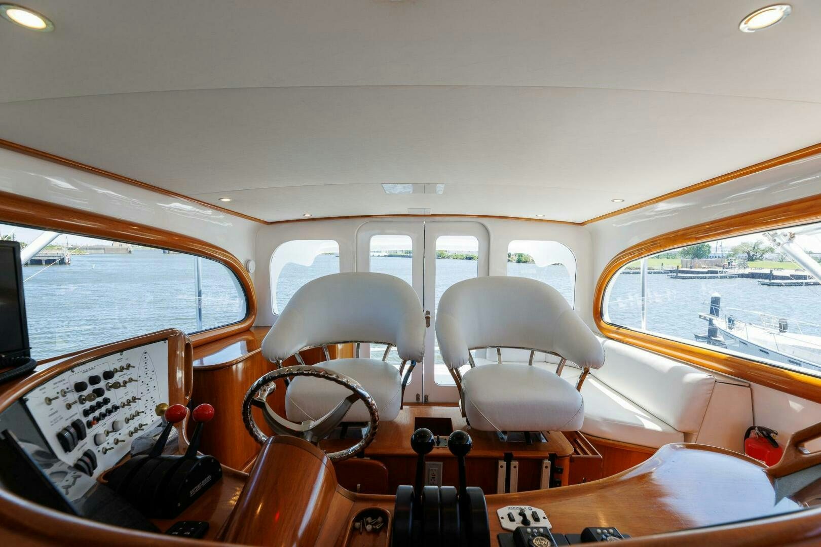 inside of a vehicle with chairs and tables and a window aboard STRESS RELIEFF  Yacht for Sale
