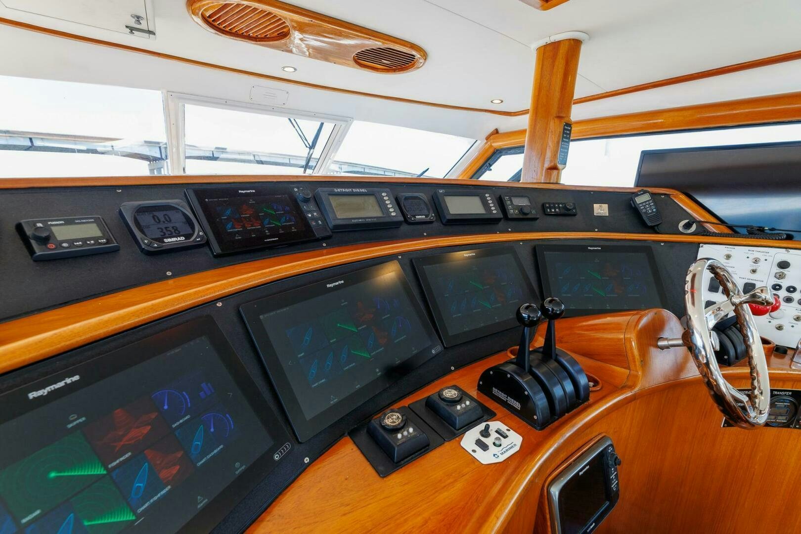 a wooden table with a black device aboard STRESS RELIEFF  Yacht for Sale