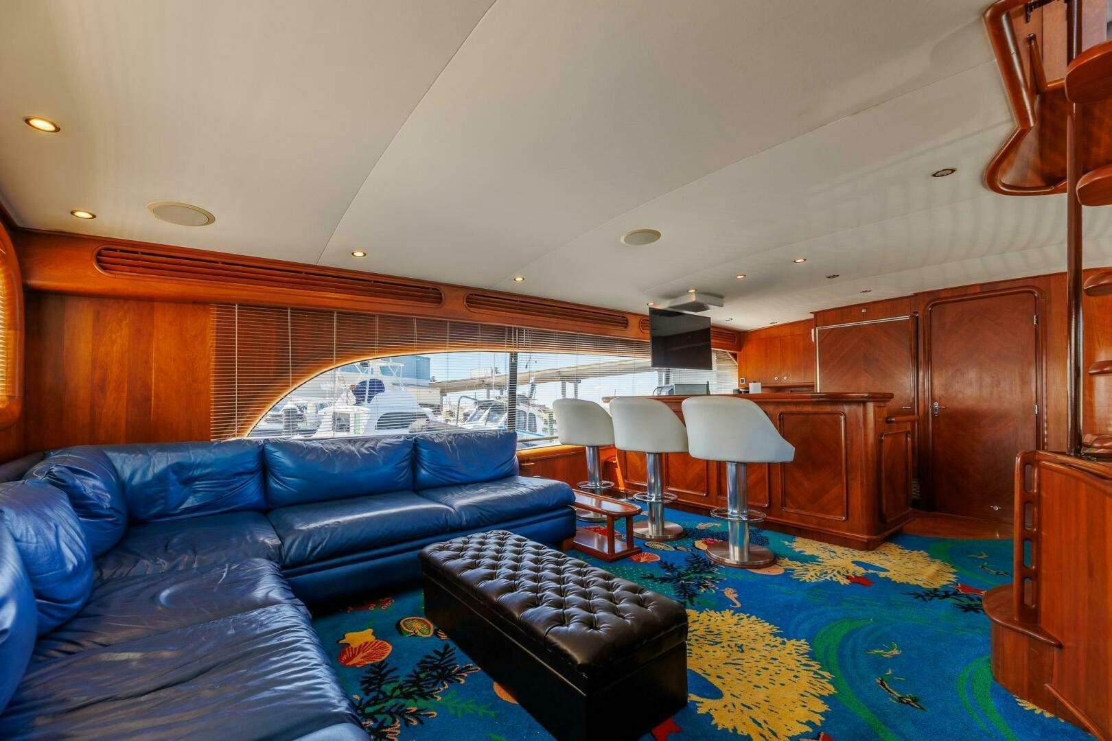 a living room with a blue couch aboard STRESS RELIEFF  Yacht for Sale