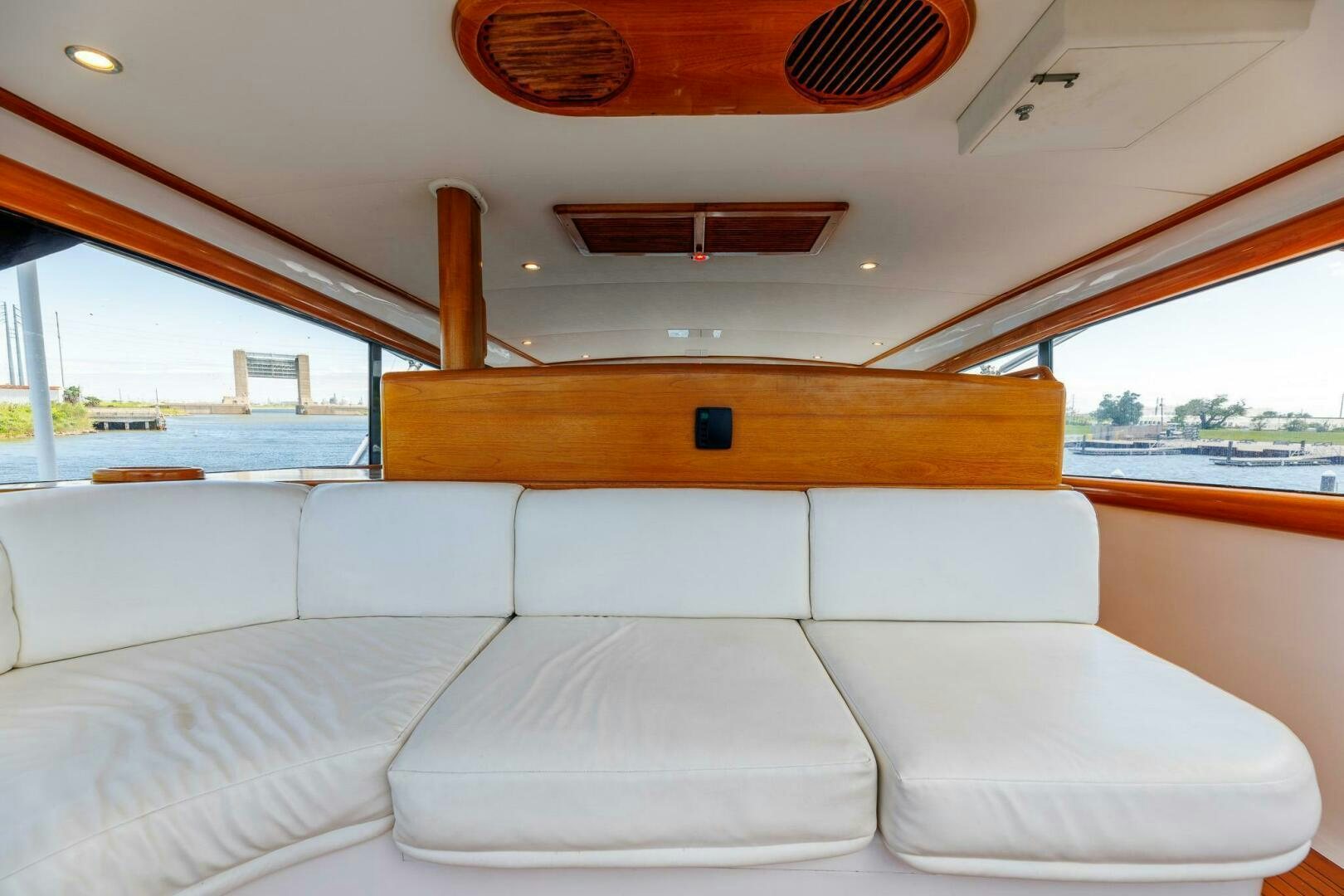 a white couch in a boat aboard STRESS RELIEFF  Yacht for Sale
