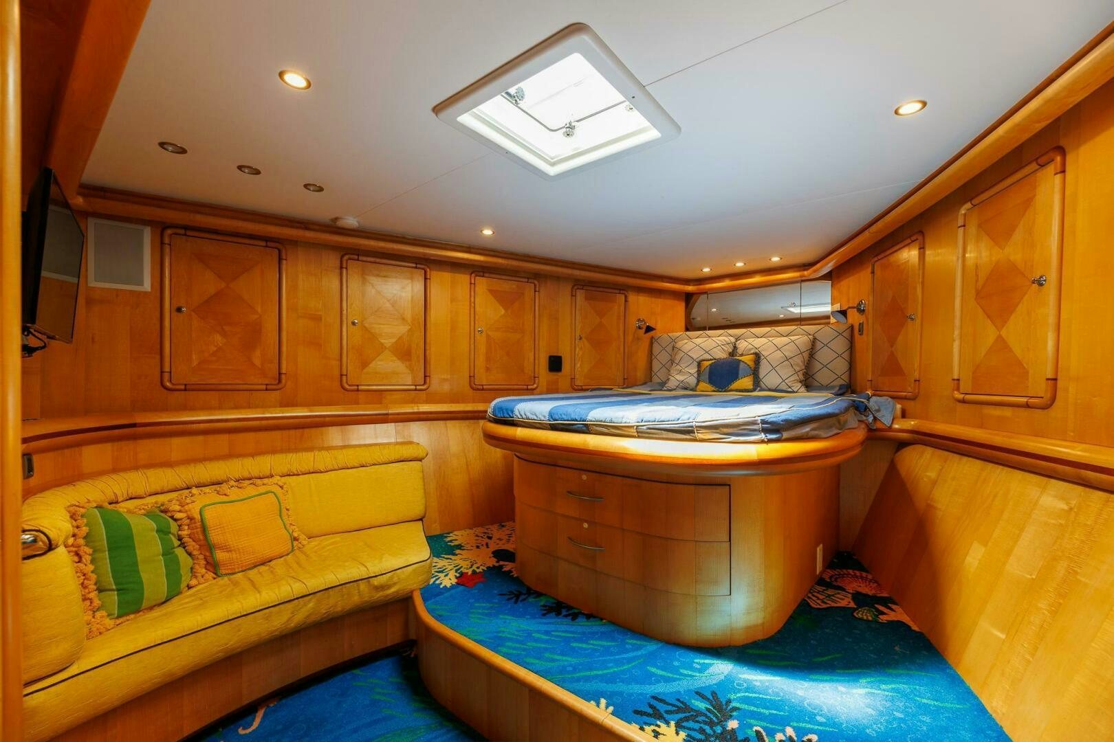 a room with a bed and a table aboard STRESS RELIEFF  Yacht for Sale