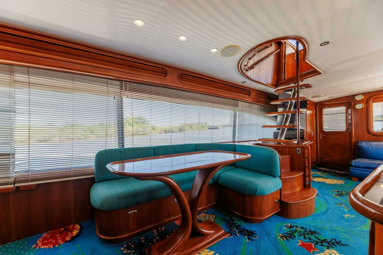 a living room with a large window aboard STRESS RELIEFF  Yacht for Sale