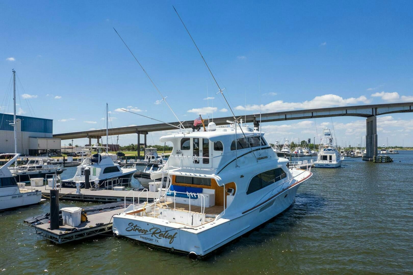 a boat docked at a pier aboard STRESS RELIEFF  Yacht for Sale