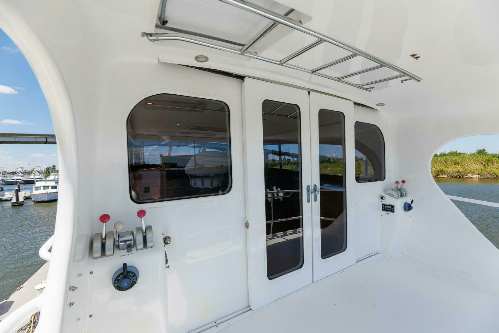 a white boat with a door open aboard STRESS RELIEFF  Yacht for Sale