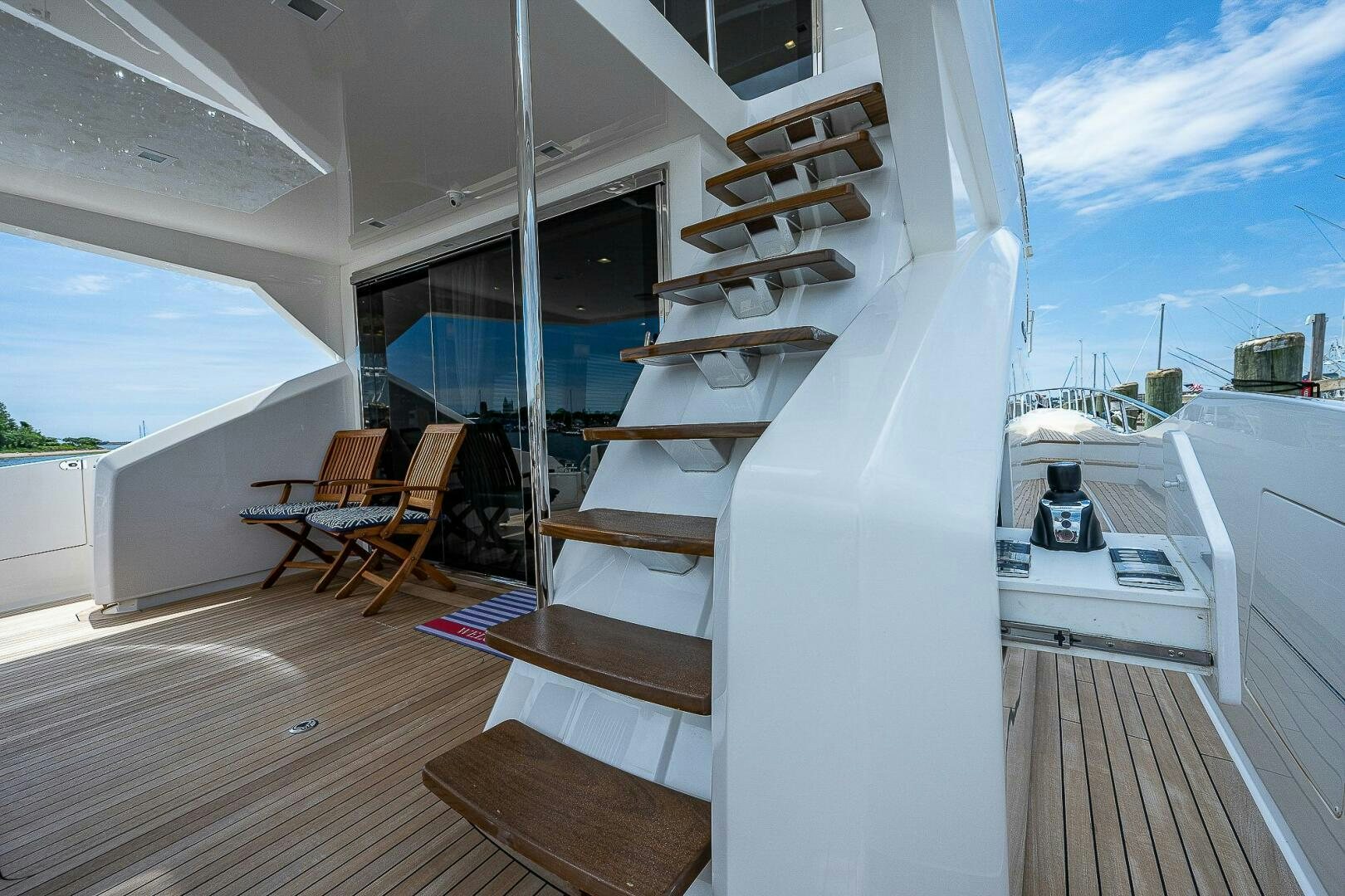 a room with a staircase and a table and chairs aboard 75 TRADE Yacht for Sale