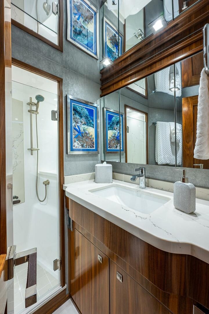 a bathroom with a shower and sink aboard 75 TRADE Yacht for Sale