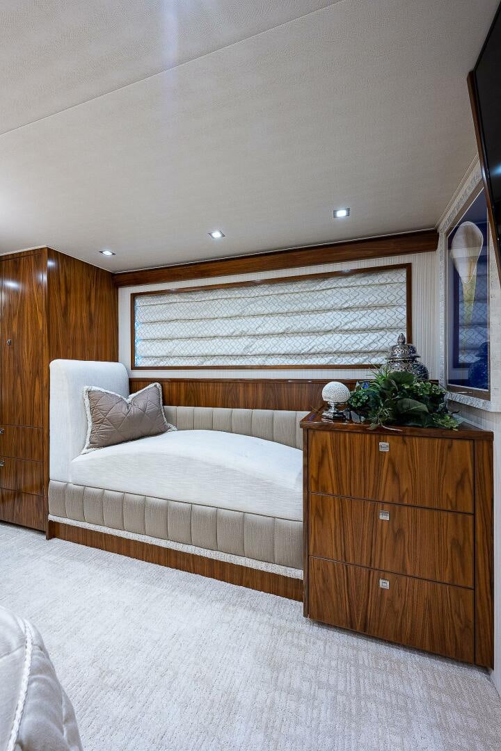 a bedroom with a bed and a dresser aboard 75 TRADE Yacht for Sale