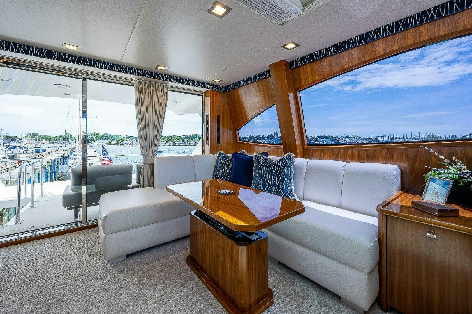 a living room with a couch and a table aboard 75 TRADE Yacht for Sale