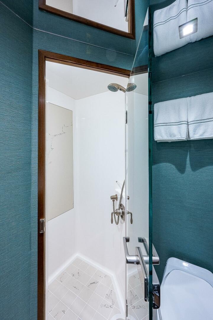 a bathroom with a white door aboard 75 TRADE Yacht for Sale