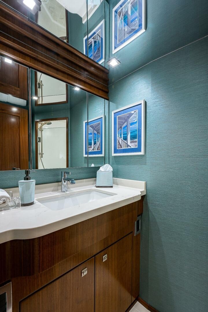 a bathroom with a sink and a mirror aboard 75 TRADE Yacht for Sale