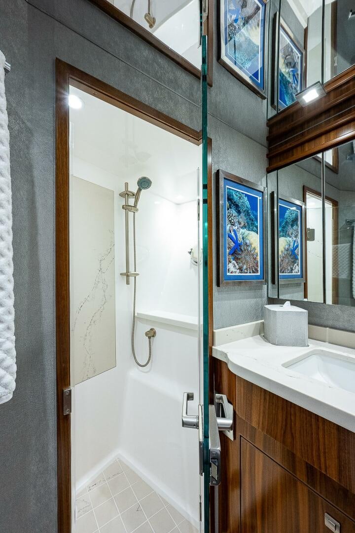 a bathroom with a shower and a sink aboard 75 TRADE Yacht for Sale