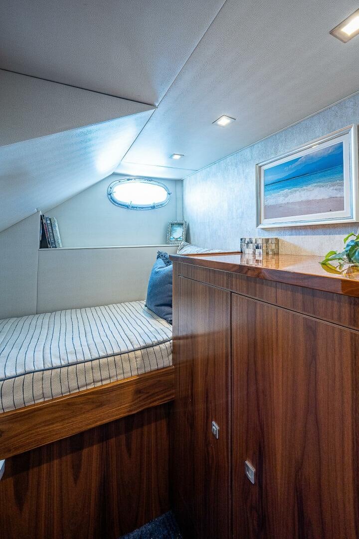 a room with a bed and a desk aboard 75 TRADE Yacht for Sale