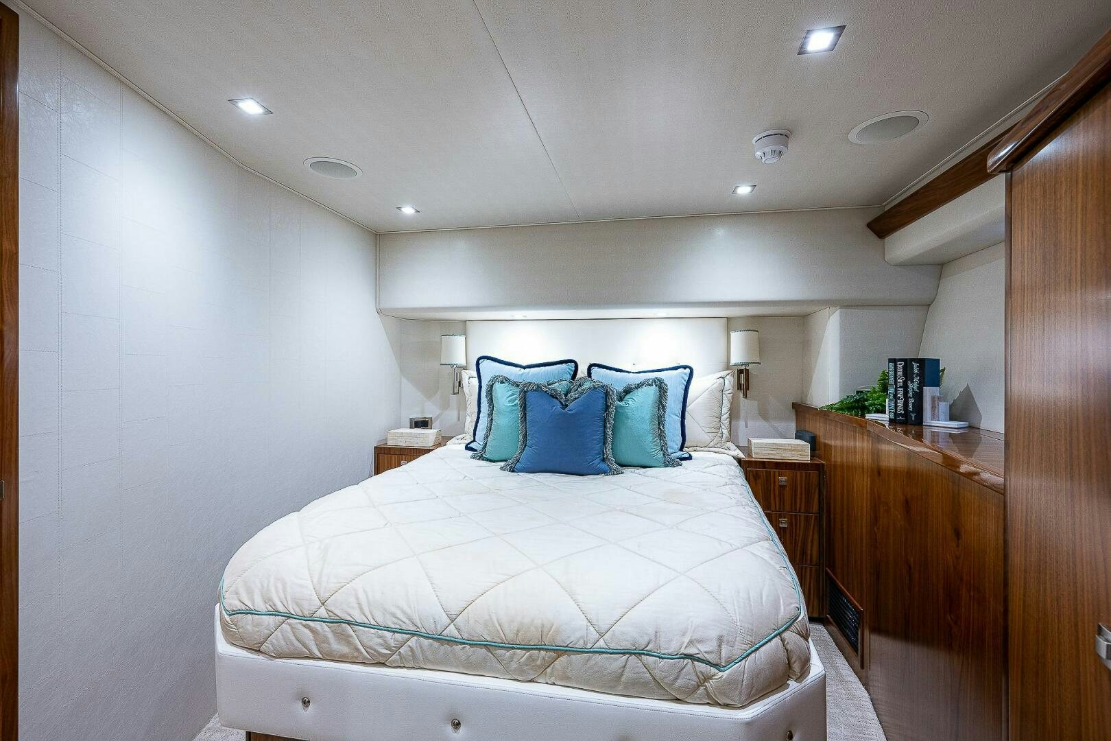a bedroom with a bed and a desk aboard 75 TRADE Yacht for Sale