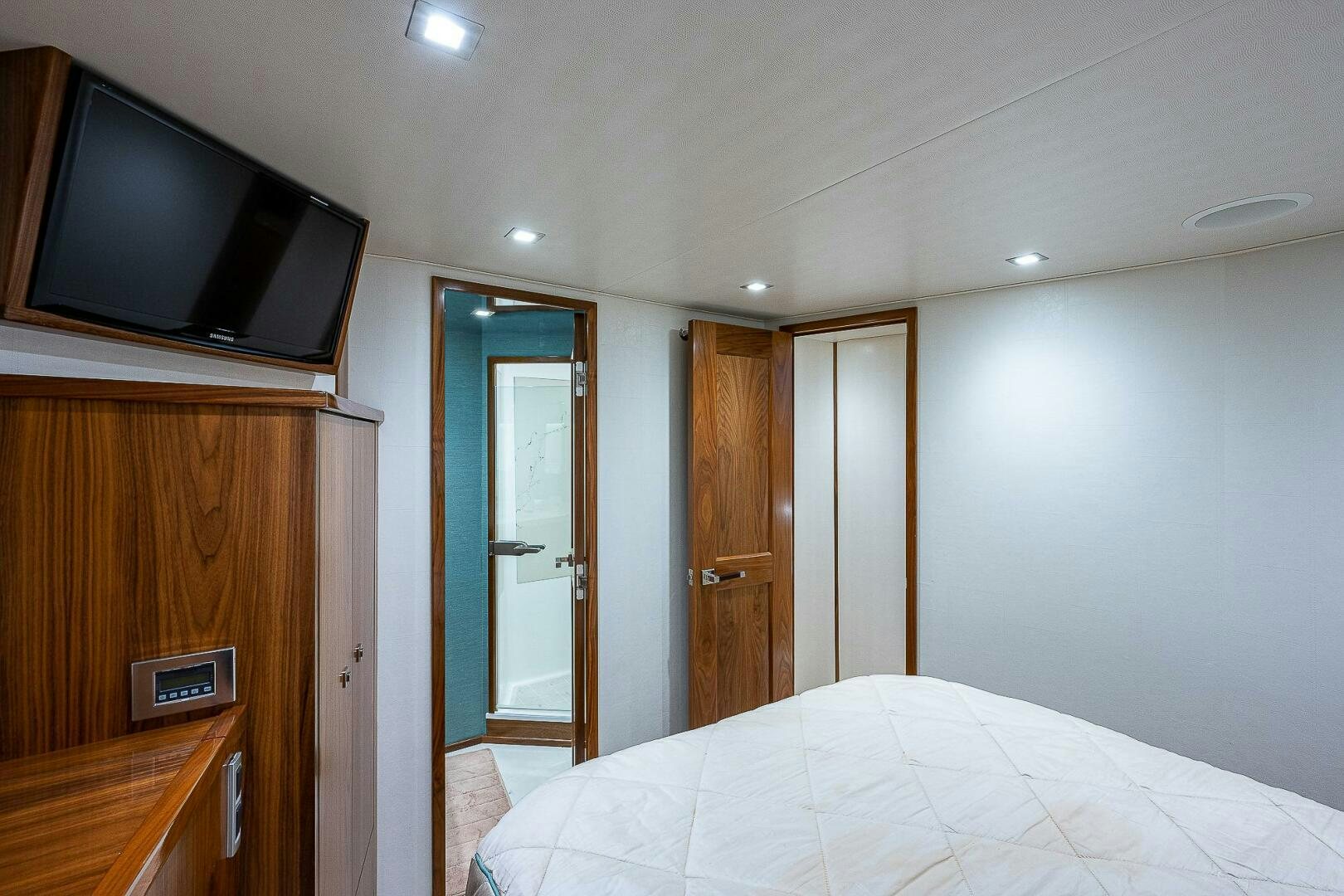 a bedroom with a tv and a bed aboard 75 TRADE Yacht for Sale