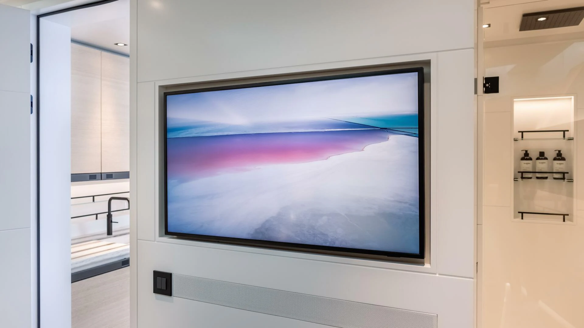 a large television screen aboard FELLOWSHIP II Yacht for Sale