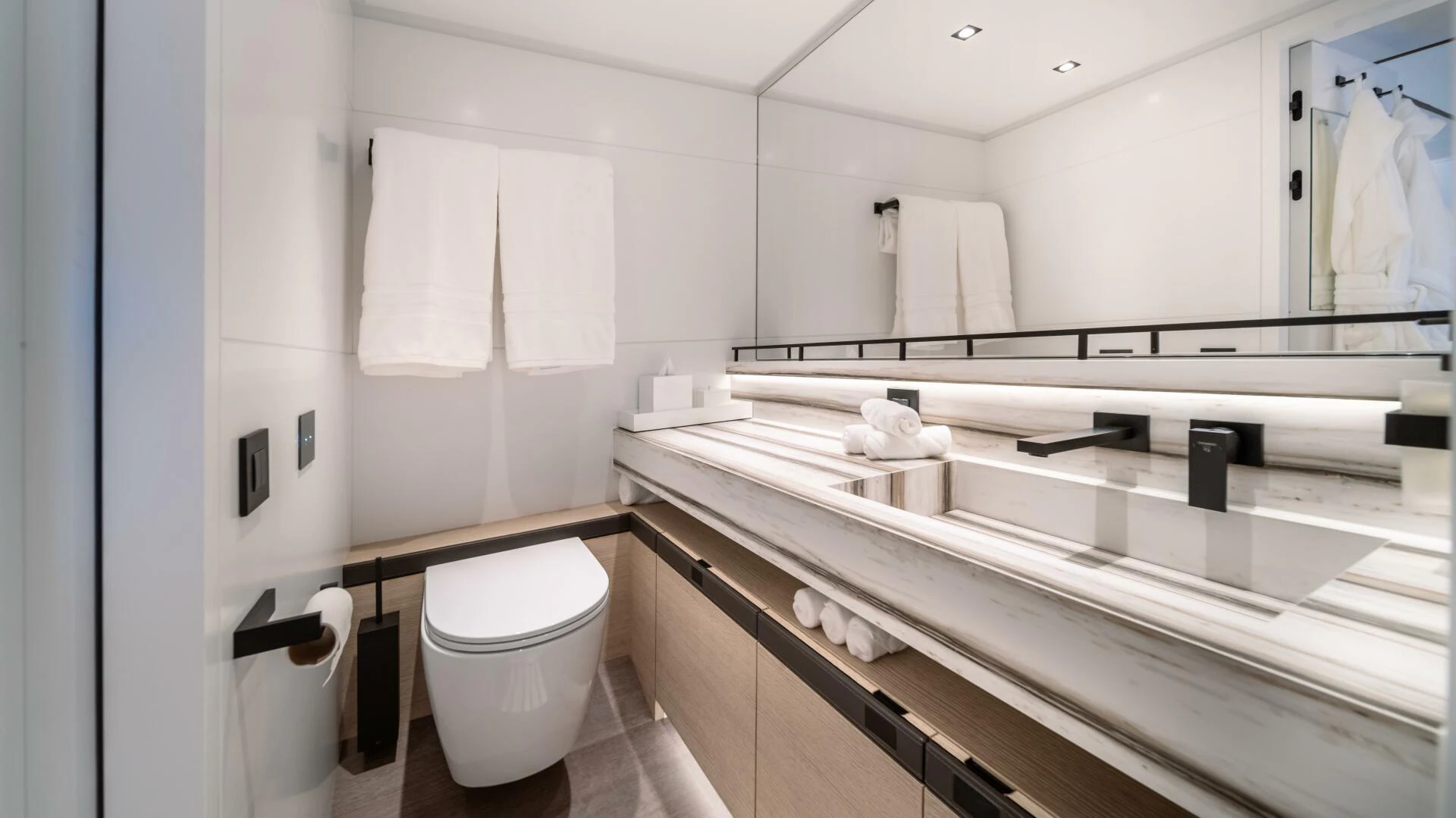 a bathroom with a large mirror aboard FELLOWSHIP II Yacht for Sale