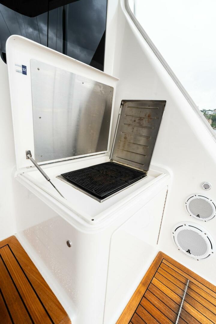 a laptop on a white shelf aboard LITTLE AUDREY Yacht for Sale