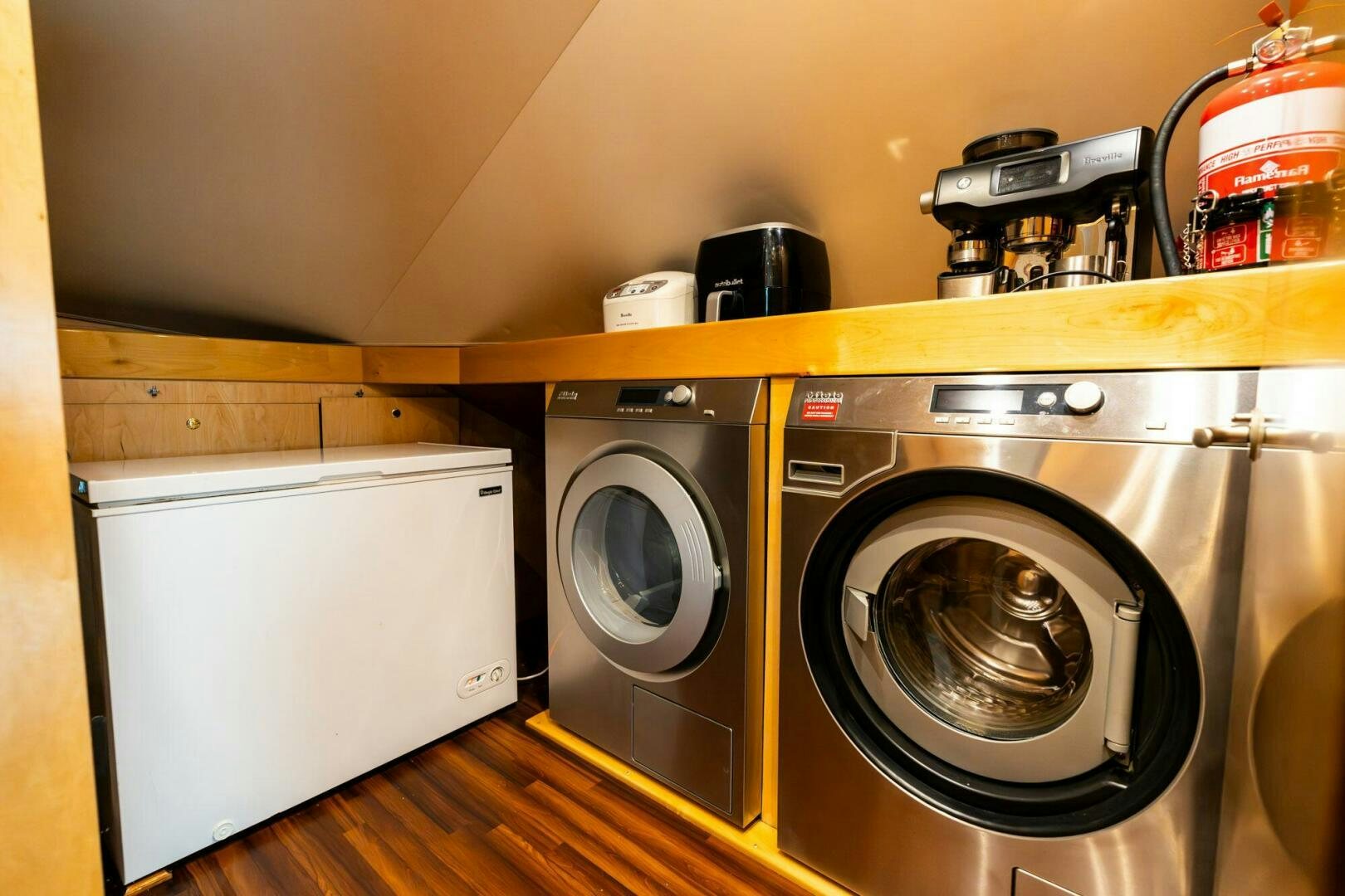 a room with a washer and dryer aboard LITTLE AUDREY Yacht for Sale