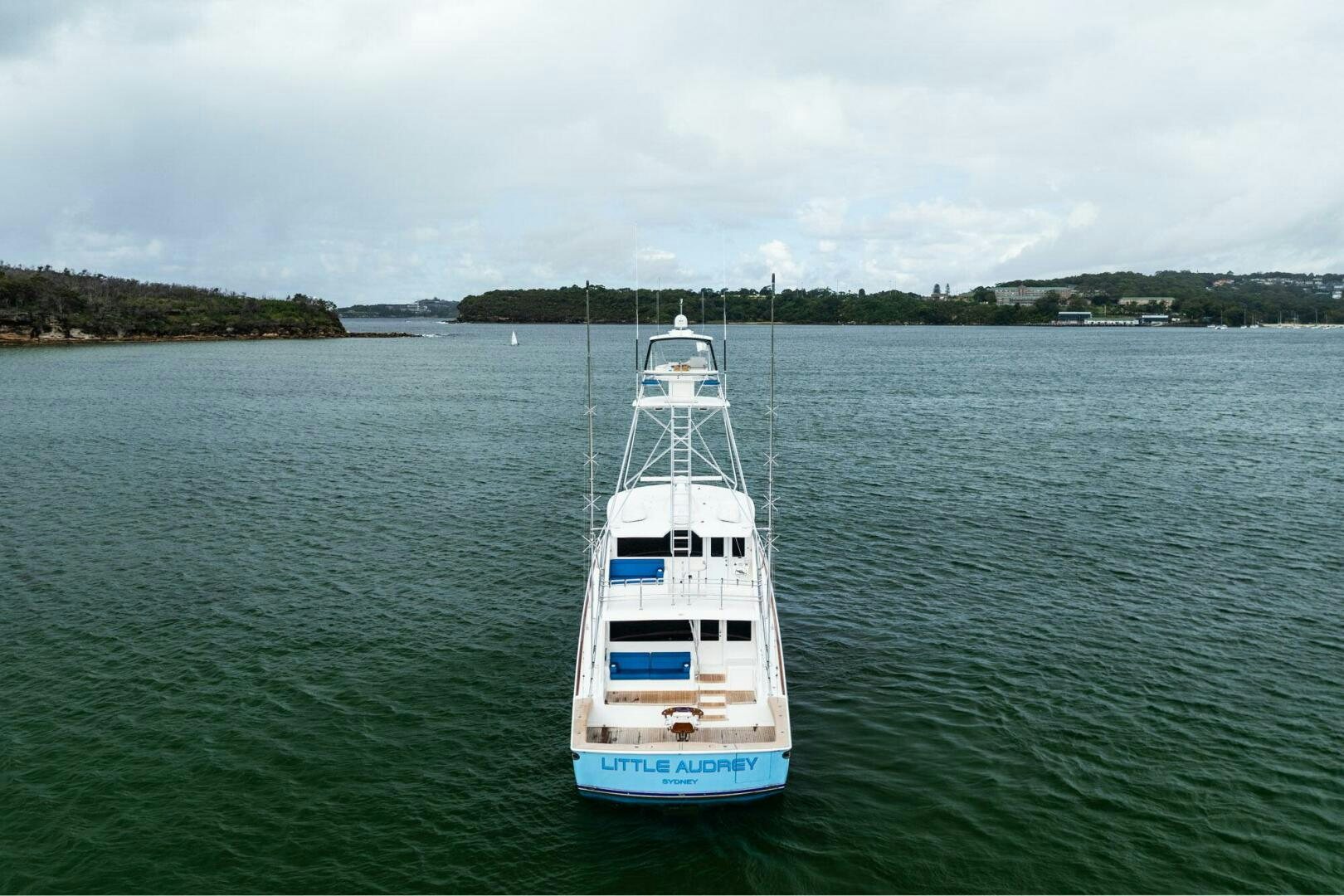 a white boat on the water aboard LITTLE AUDREY Yacht for Sale