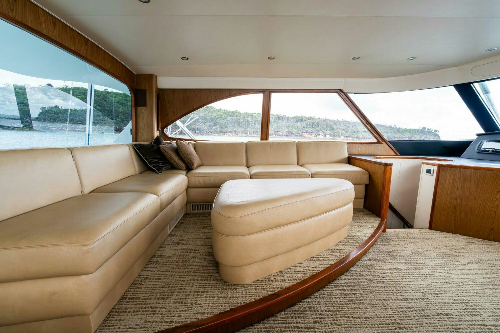 a living room with a couch and a large window aboard LITTLE AUDREY Yacht for Sale