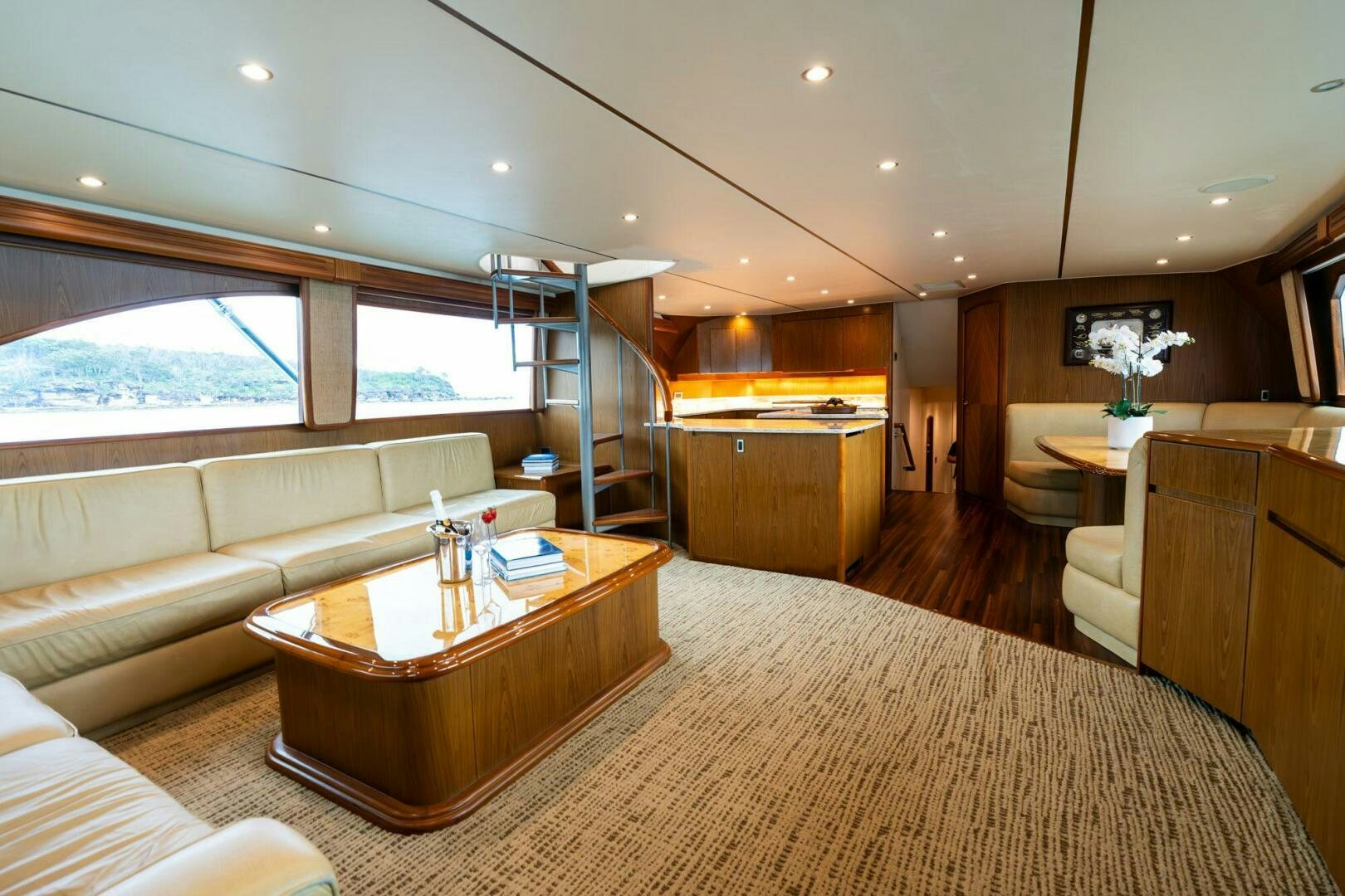 a living room with a large window aboard LITTLE AUDREY Yacht for Sale