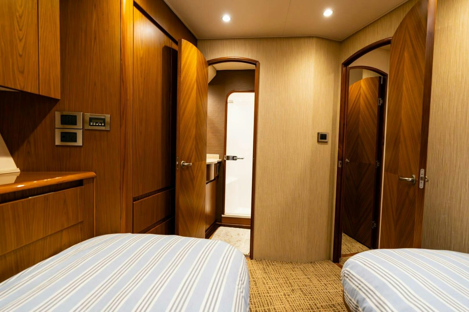 a hotel room with a bed and a closet aboard LITTLE AUDREY Yacht for Sale