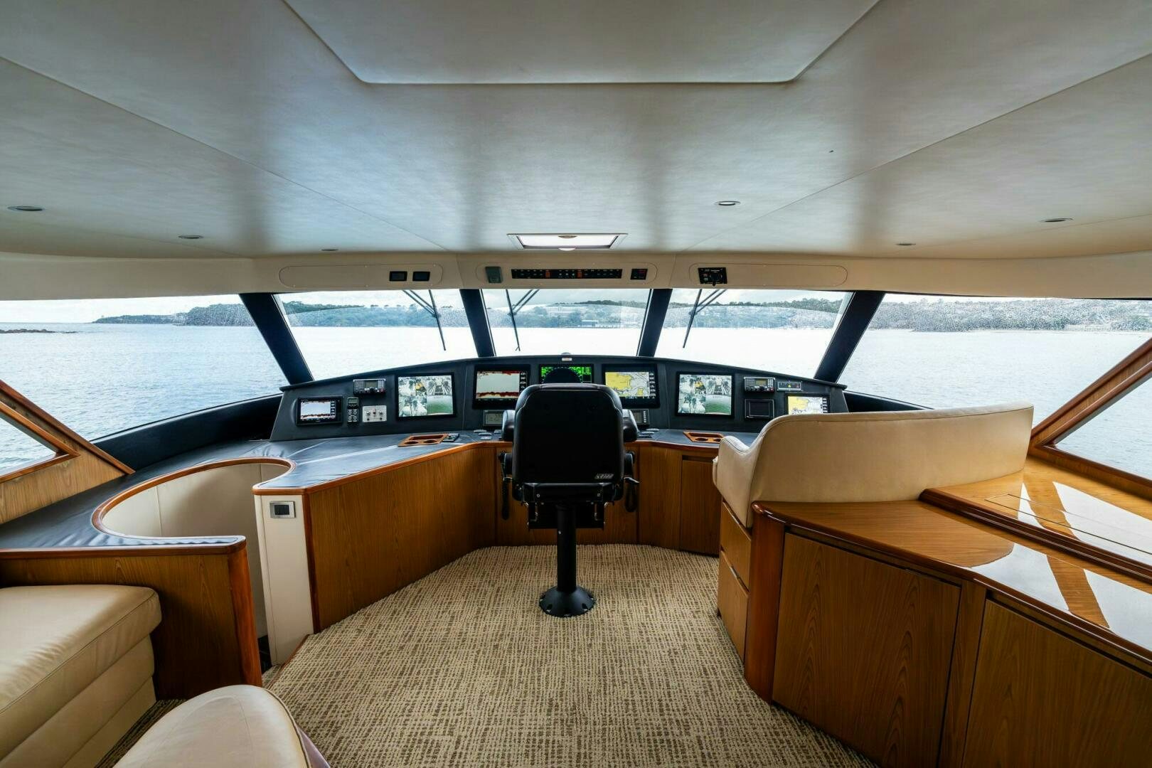 a boat with a chair and a desk in it aboard LITTLE AUDREY Yacht for Sale