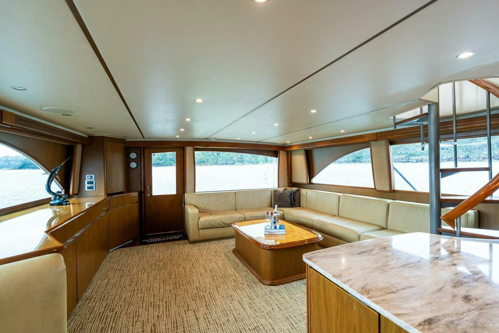 a living room with a couch and a table aboard LITTLE AUDREY Yacht for Sale