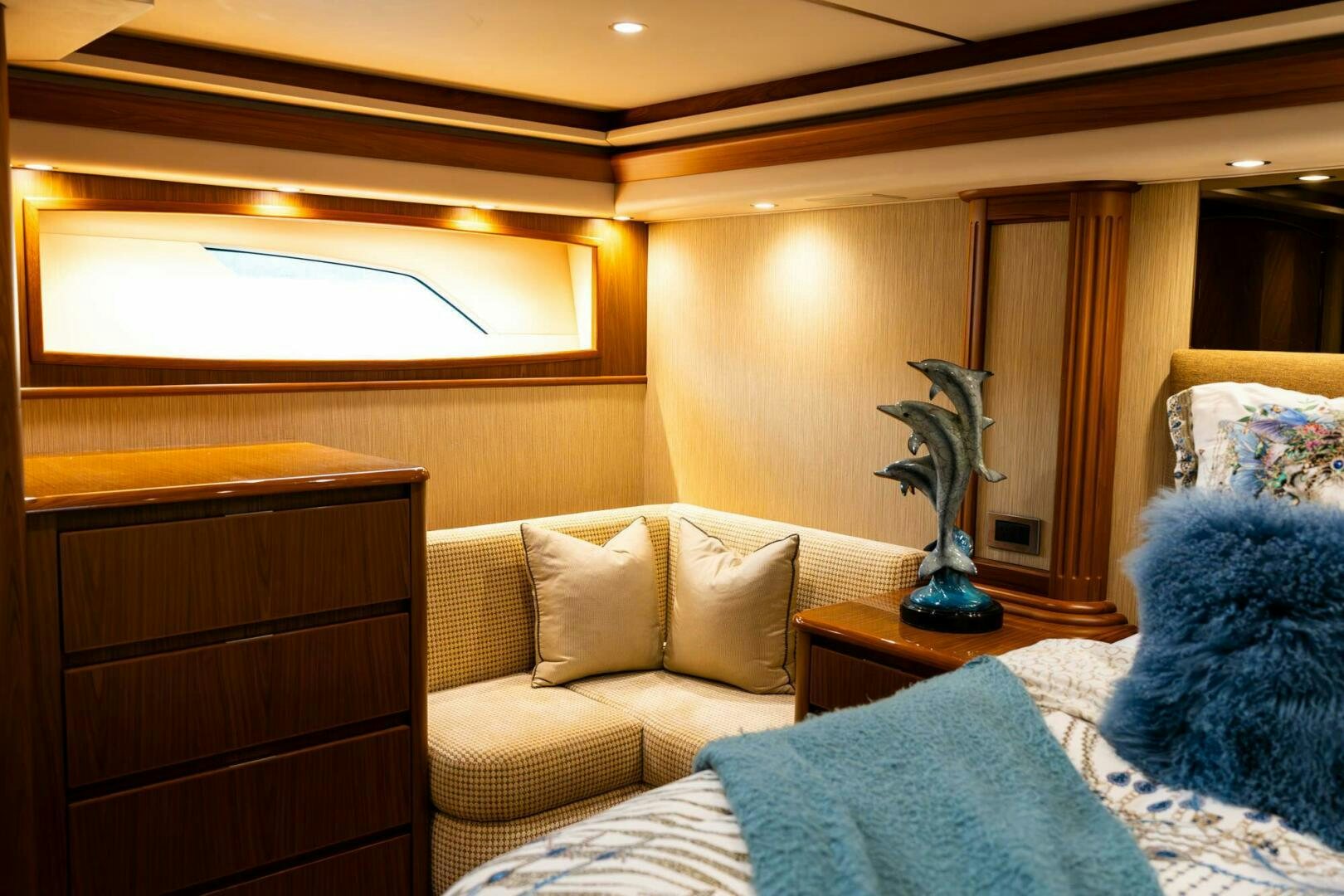 a room with a couch and a vase on a table aboard LITTLE AUDREY Yacht for Sale