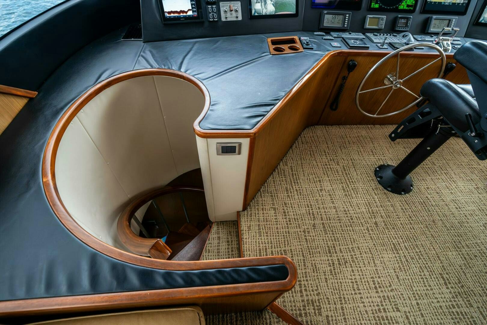 a wooden chair with a wooden seat aboard LITTLE AUDREY Yacht for Sale