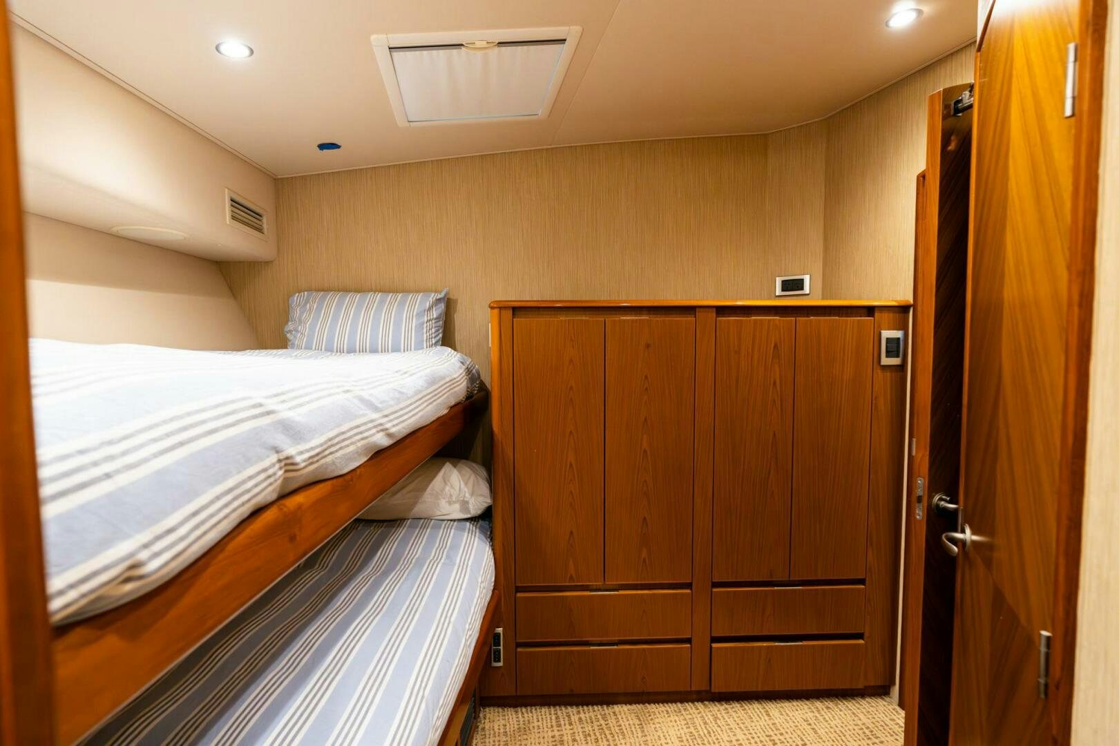 a room with a bed and a closet aboard LITTLE AUDREY Yacht for Sale