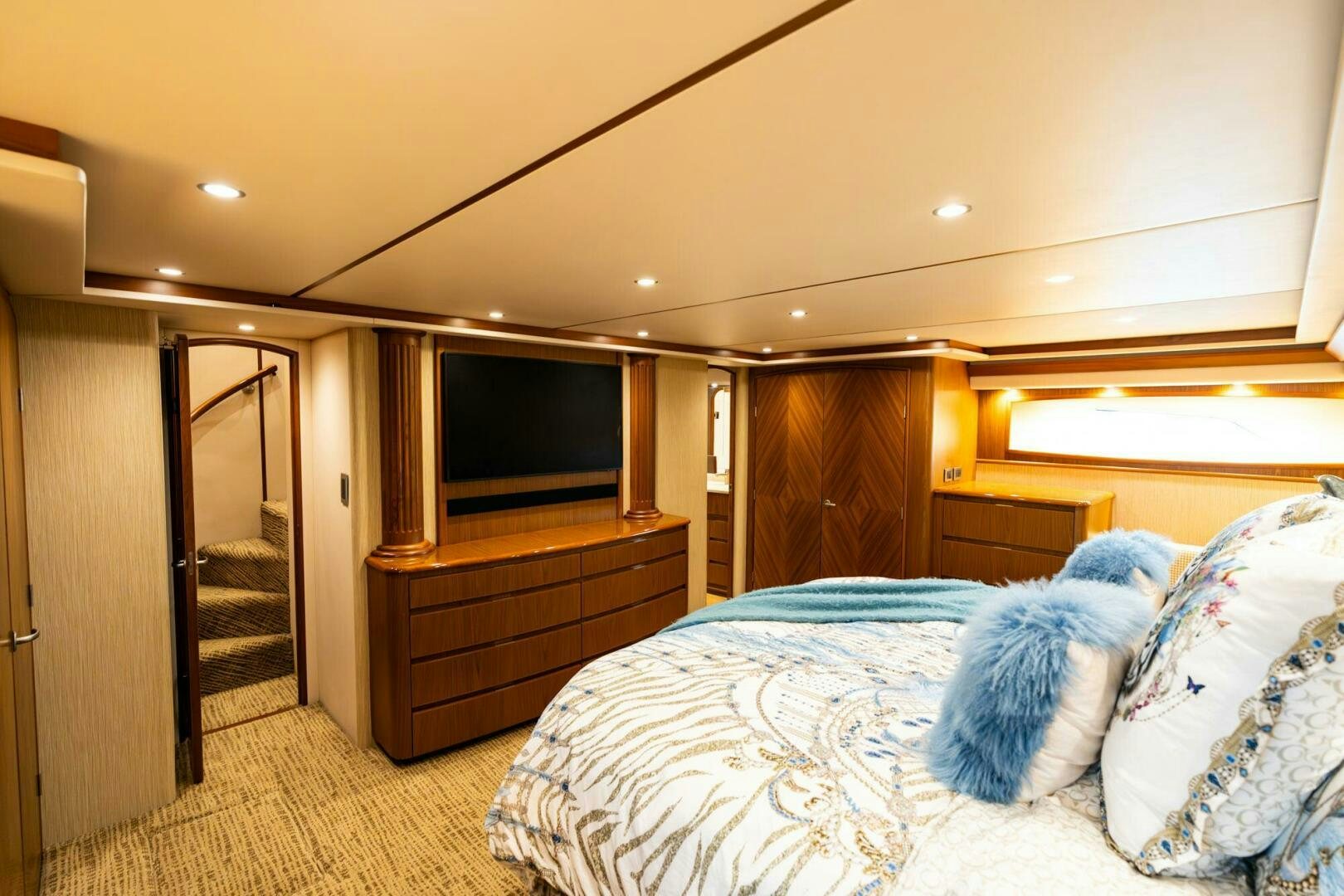 a bedroom with a bed and a television aboard LITTLE AUDREY Yacht for Sale
