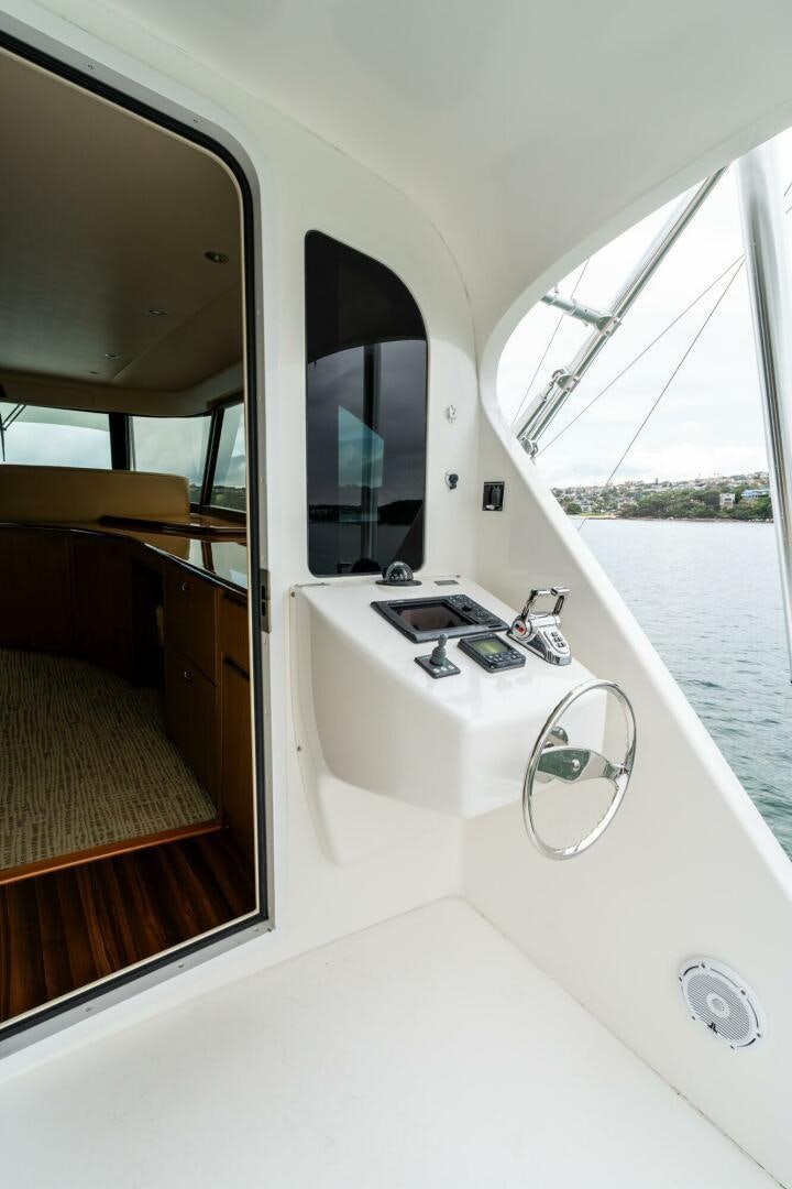 a bathroom with a sink and a window aboard LITTLE AUDREY Yacht for Sale