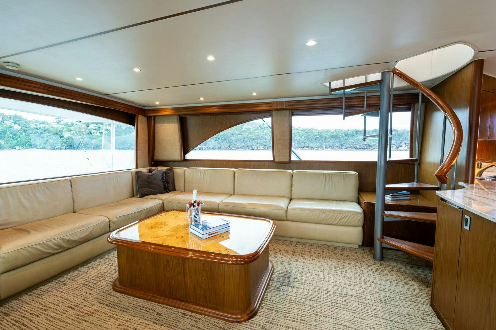 a living room with a couch and a table aboard LITTLE AUDREY Yacht for Sale