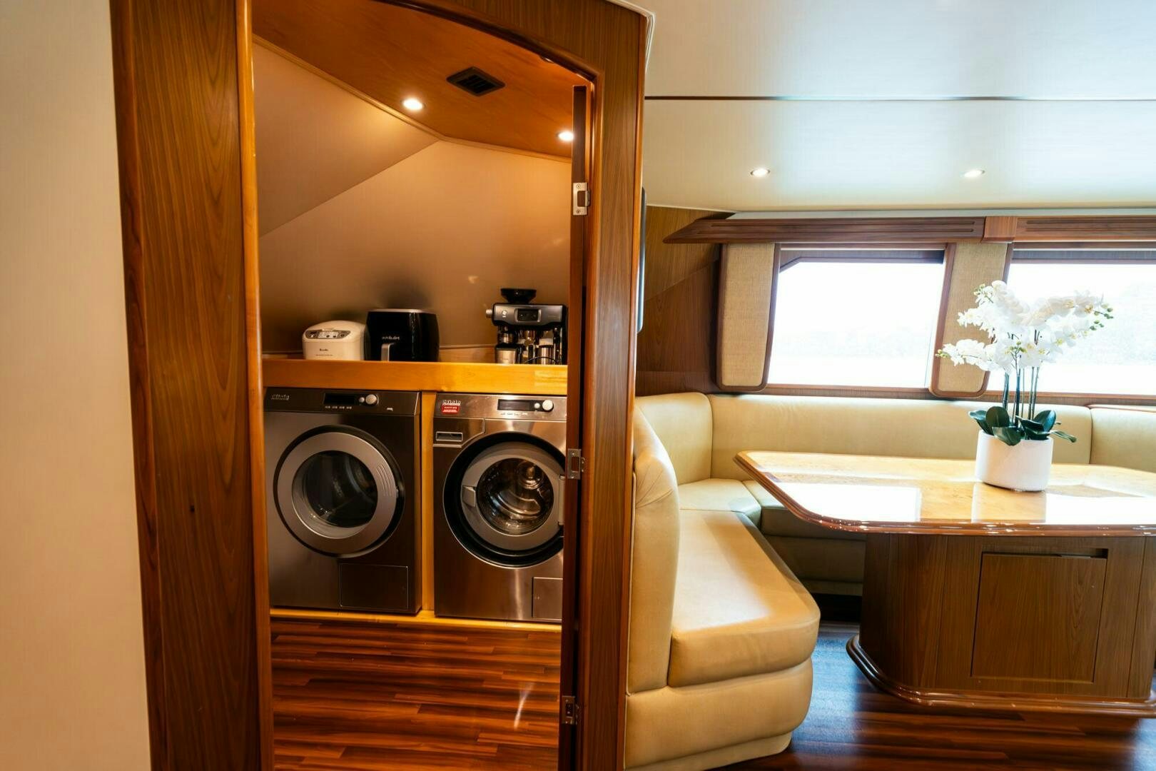 a room with a washer and a table aboard LITTLE AUDREY Yacht for Sale