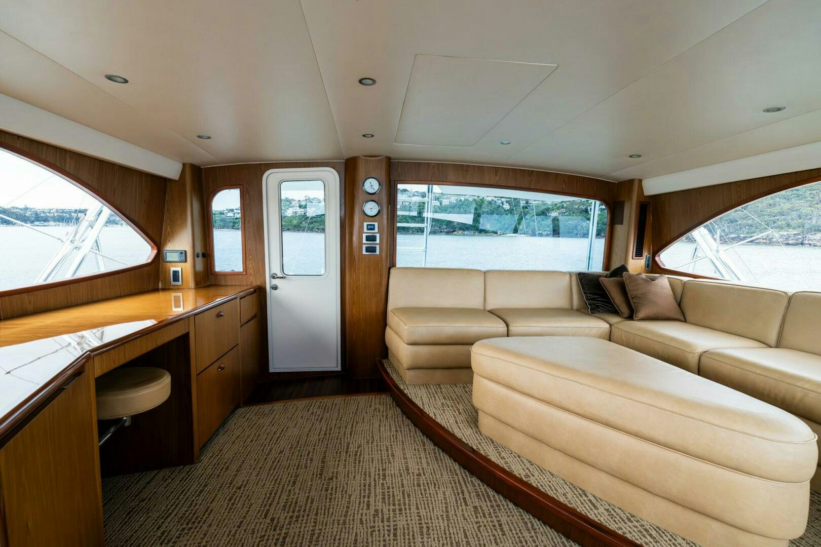 a living room with a couch and a table aboard LITTLE AUDREY Yacht for Sale