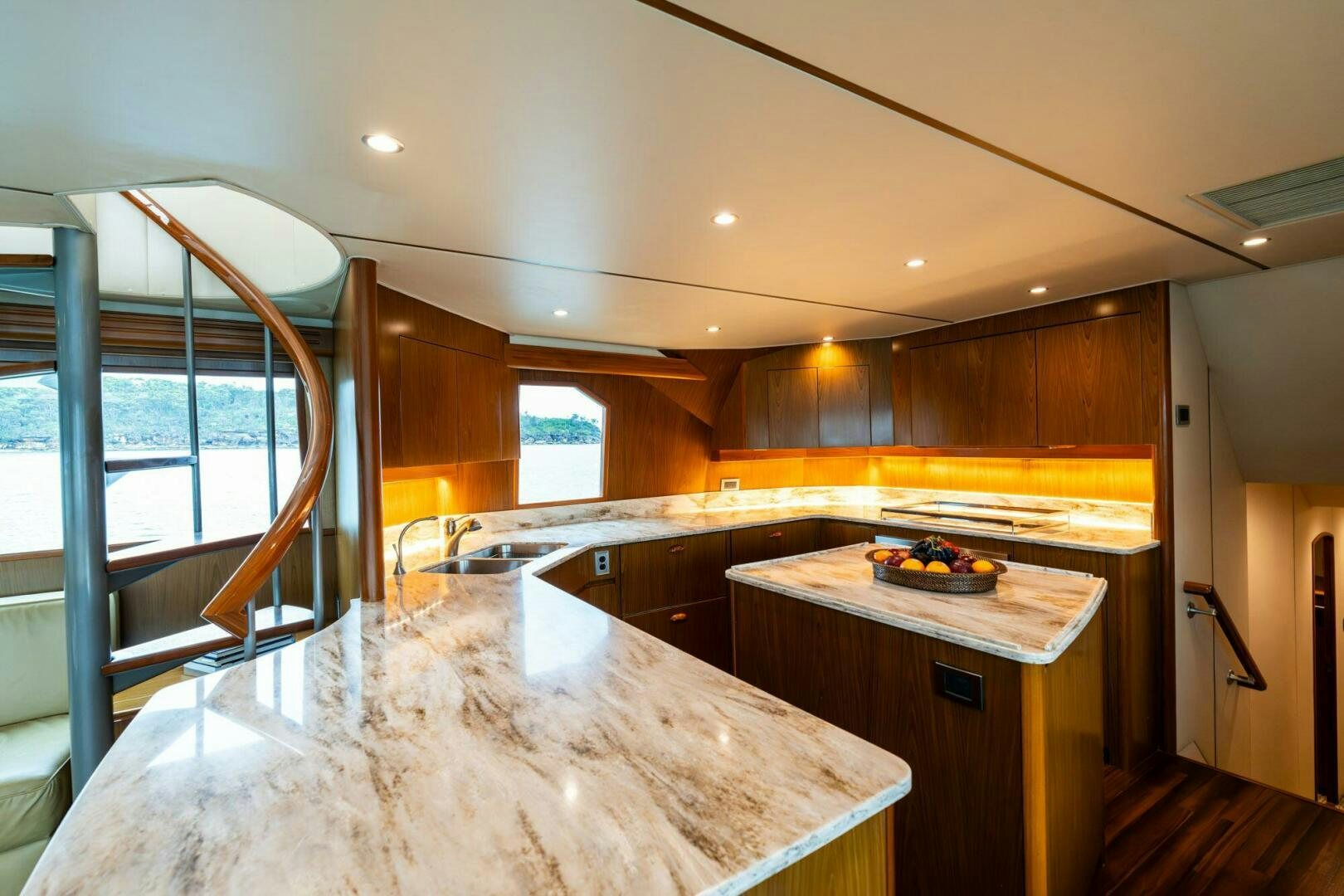 a kitchen with a large window aboard LITTLE AUDREY Yacht for Sale