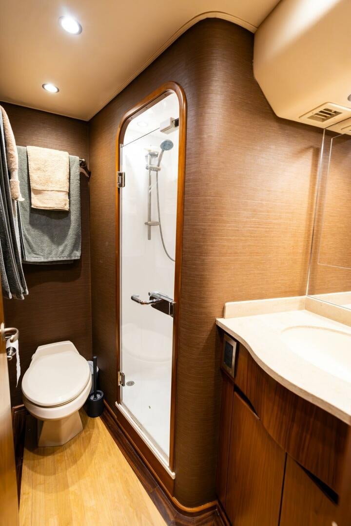 a bathroom with a sink and a toilet aboard LITTLE AUDREY Yacht for Sale