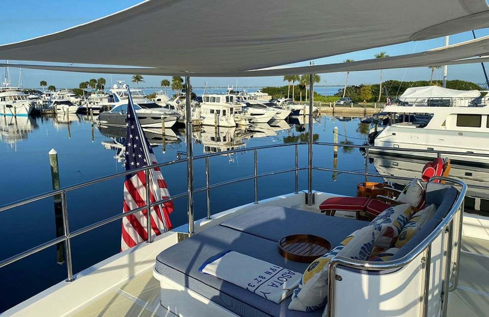 a boat with a flag on it aboard JULIANNE Yacht for Sale