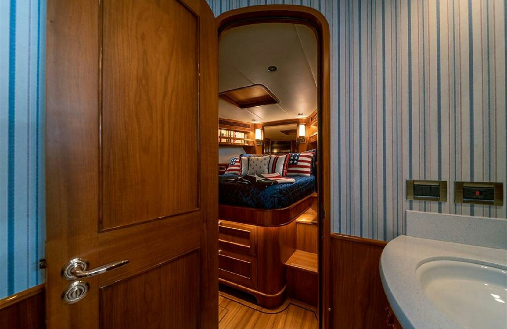 a bathroom with a mirror and a bed aboard JULIANNE Yacht for Sale