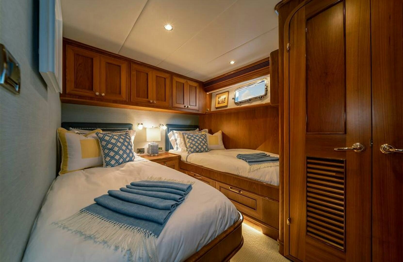a room with a bed and a closet aboard JULIANNE Yacht for Sale