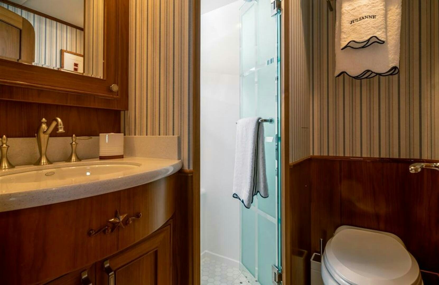 a bathroom with a sink and toilet aboard JULIANNE Yacht for Sale