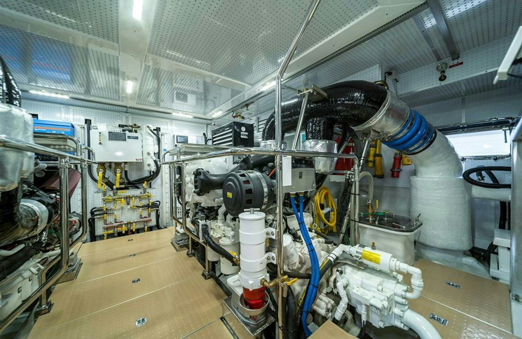 a large white machine with blue cables aboard JULIANNE Yacht for Sale