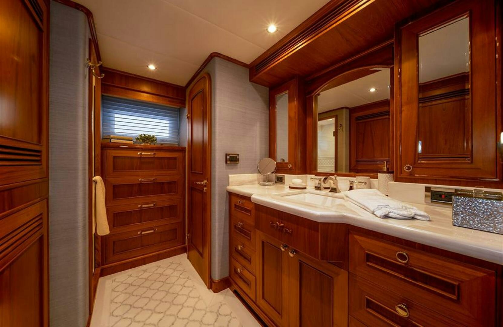 a kitchen with wooden cabinets aboard JULIANNE Yacht for Sale