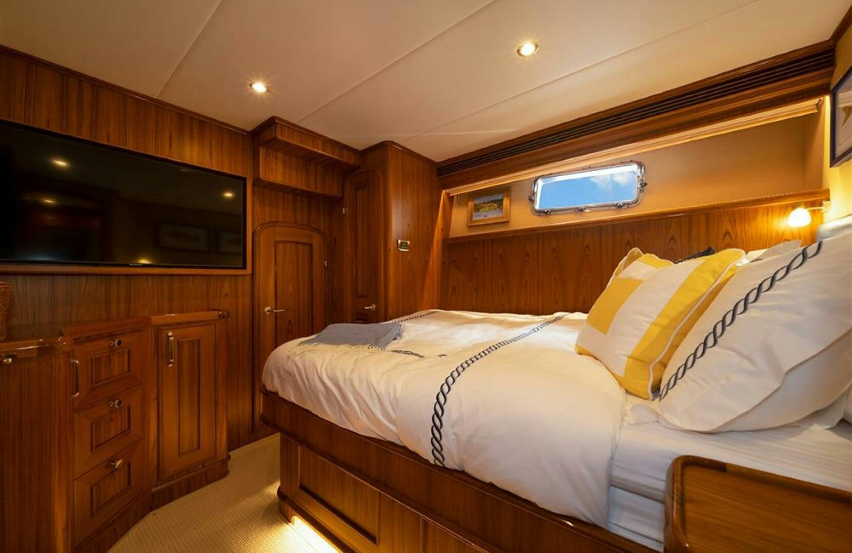 a bed in a wooden room aboard JULIANNE Yacht for Sale