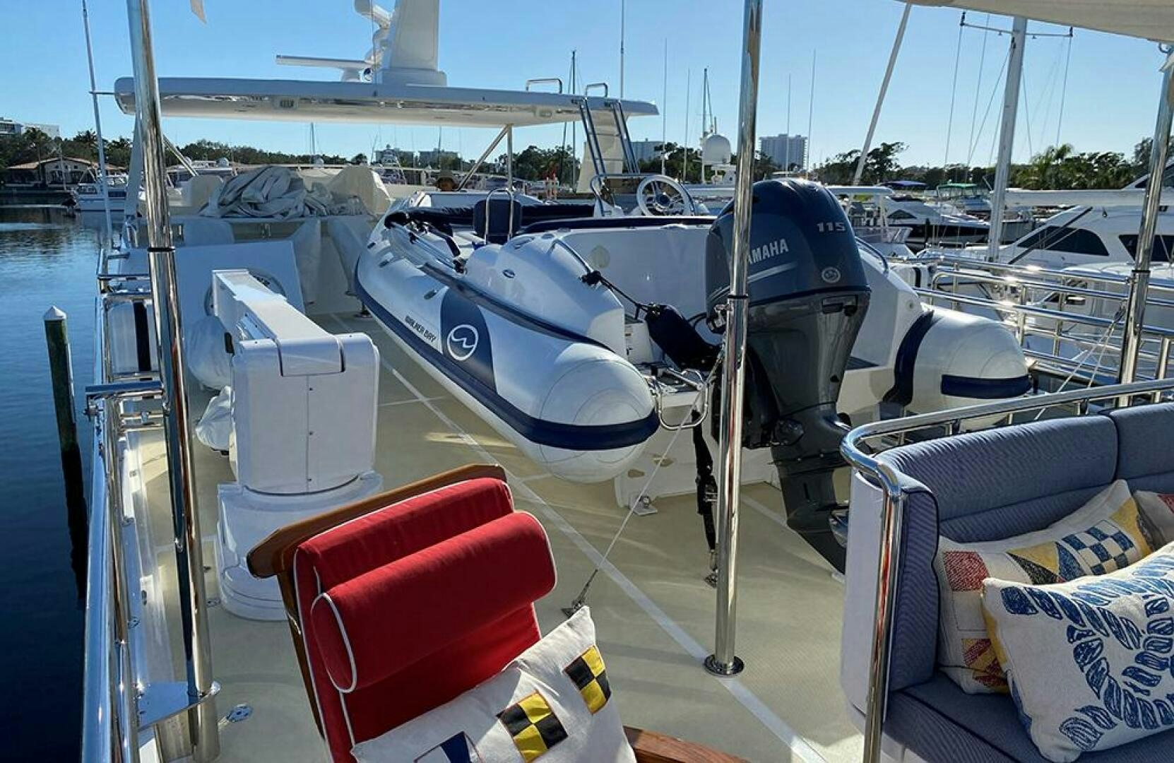 a boat with a deck and chairs aboard JULIANNE Yacht for Sale