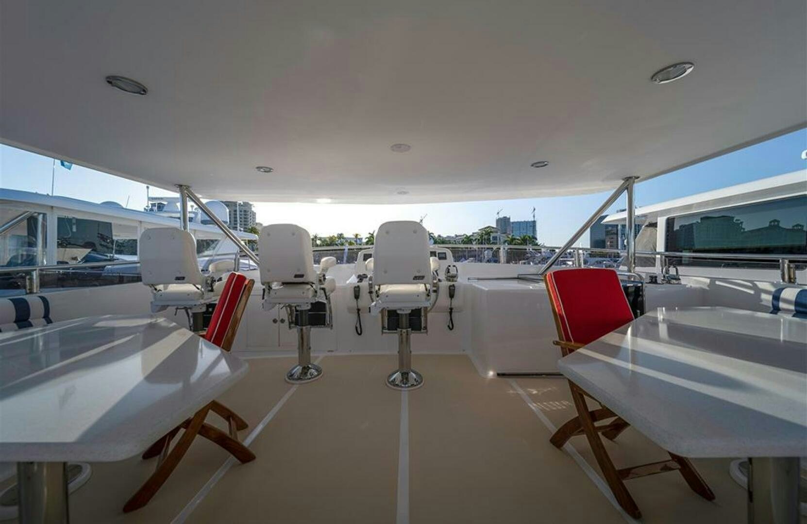 a room with chairs and tables aboard JULIANNE Yacht for Sale