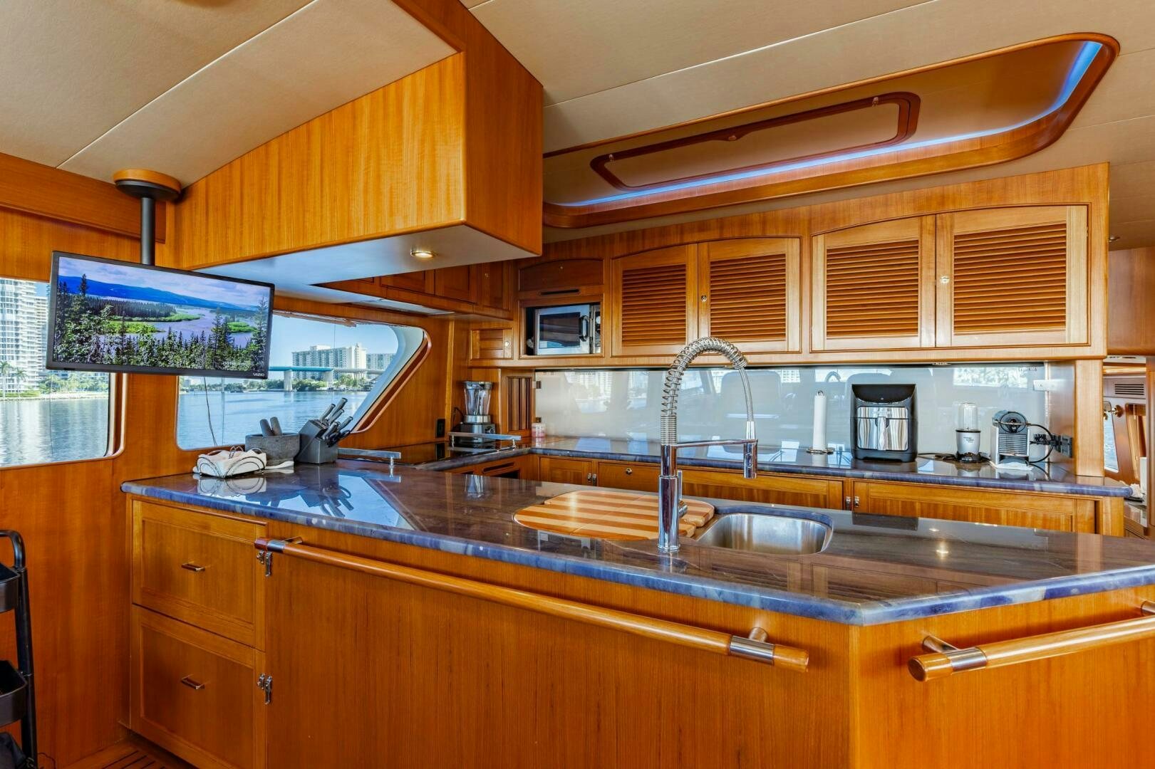 a kitchen with wooden cabinets aboard VIRGINIA SEA Yacht for Sale