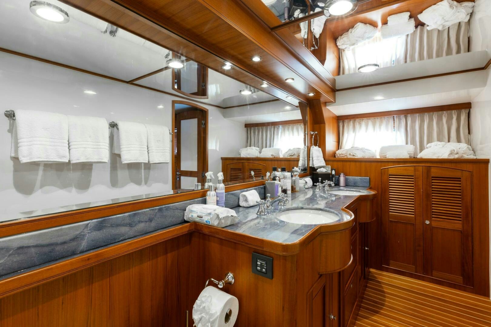 a bathroom with a large mirror aboard VIRGINIA SEA Yacht for Sale