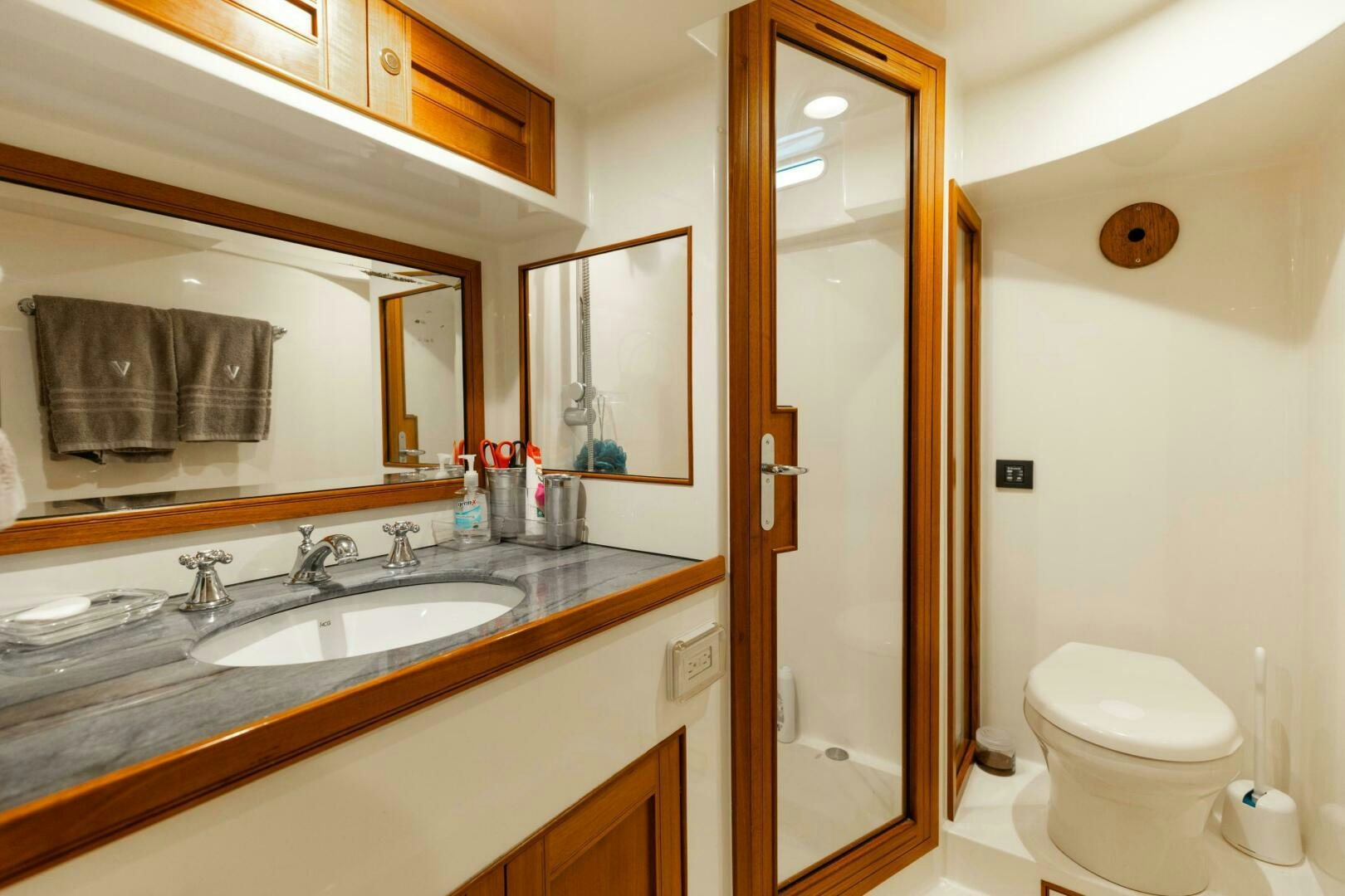 a bathroom with a sink and toilet aboard VIRGINIA SEA Yacht for Sale
